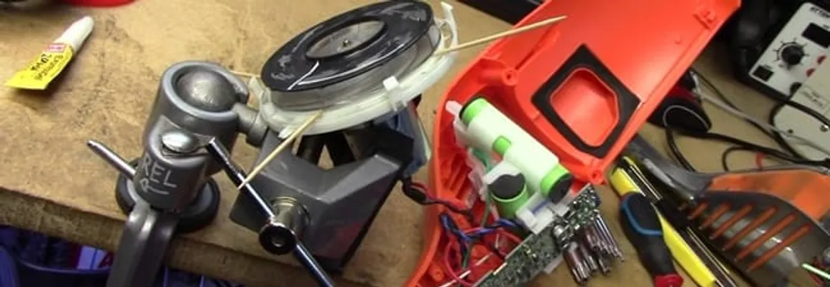 Vacuum cleaner repair parts and tools on a workbench in Hialeah, FL